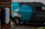 An electric charger with a van in the background