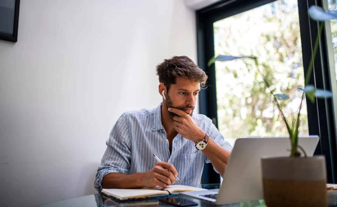 Man With Head Phones And Laptop