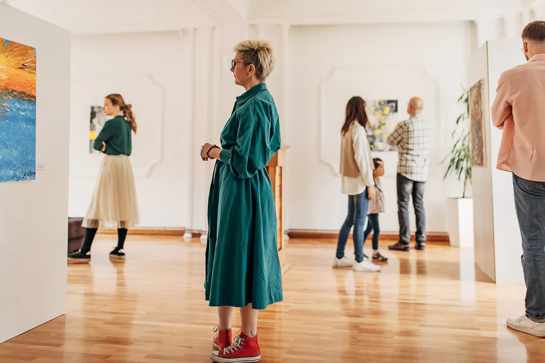 Woman Buying Artwork At A Gallery