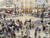 A busy high street in London with dozens of shoppers walking around