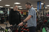 Customer in a cycle shop talking to a bicycle expert about a new bike