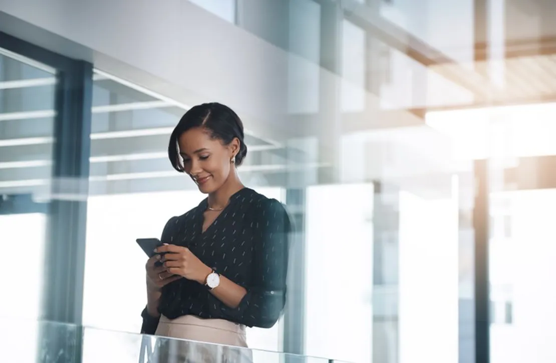 Woman On Phone In Modern Building