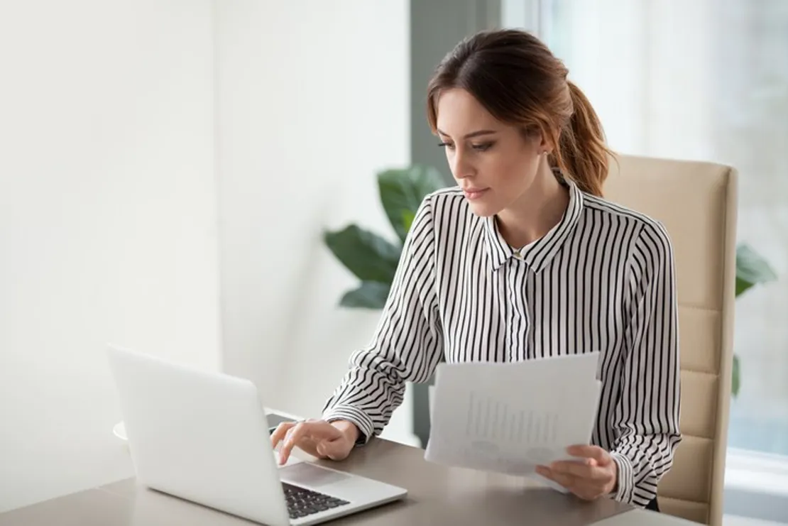 Serious Focused Businesswoman Typing On Laptop