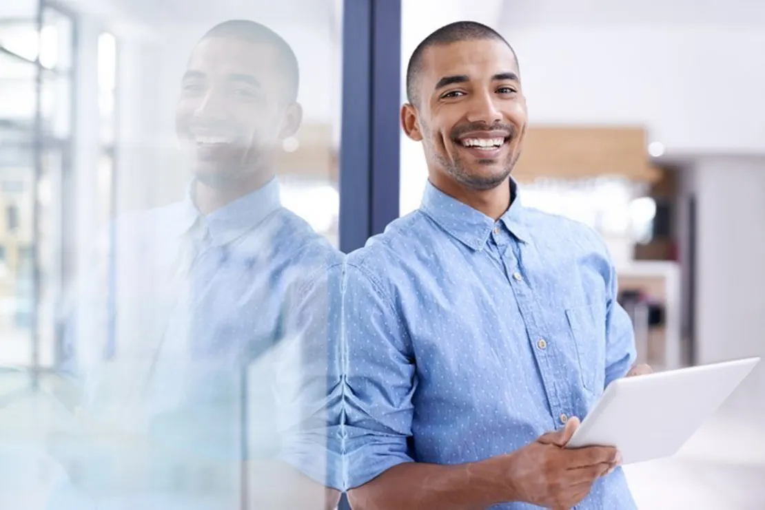 Young Businessman Working On Tablet